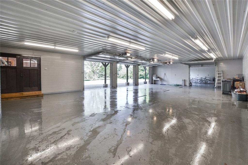 394 Game Farm Road New Castle, PA 16101 - Photo 19 of 25 Four total garage spaces large enough to accommodate tall trucks, boats etc. The fourth stall will fit a car, small SUVs, motorcycles, or bikes!