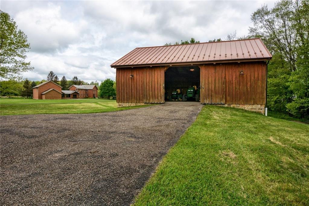 394 Game Farm Road New Castle, PA 16101 - Photo 20 of 25 The bank barn, built in 2008, is a great space for tractors with another two stall garage on the lower level.