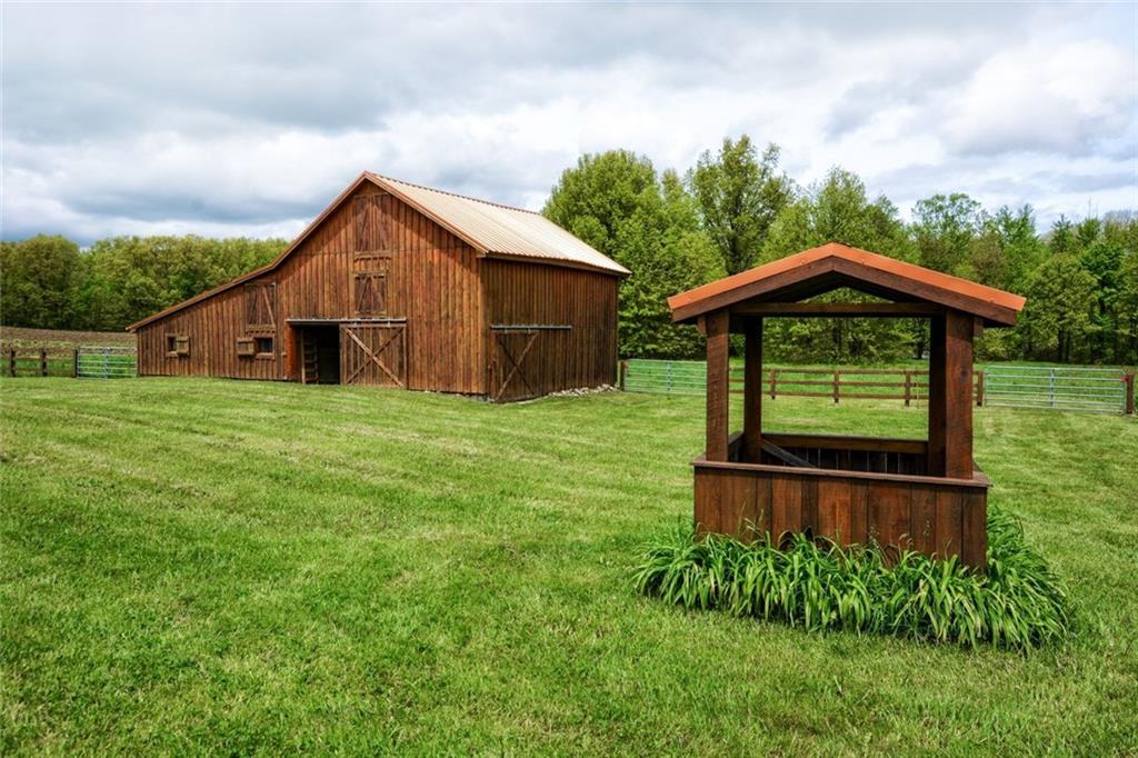 394 Game Farm Road New Castle, PA 16101 - Photo 23 of 25 The original barn was restored. There are four stalls and a feeding trough on the inside.