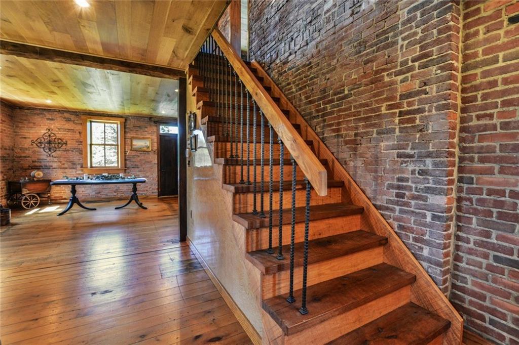 394 Game Farm Road New Castle, PA 16101 - Photo 9 of 25 Gorgeous staircase with iron balusters and solid original wood stair treads.