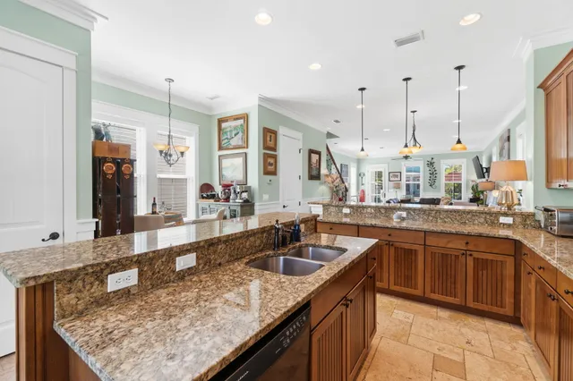 a large kitchen with cabinets table and chairs
