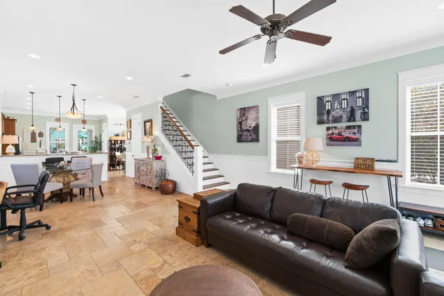 a dining room with furniture and window