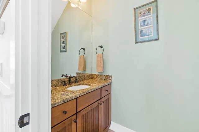 a bedroom with a large bed and a desk