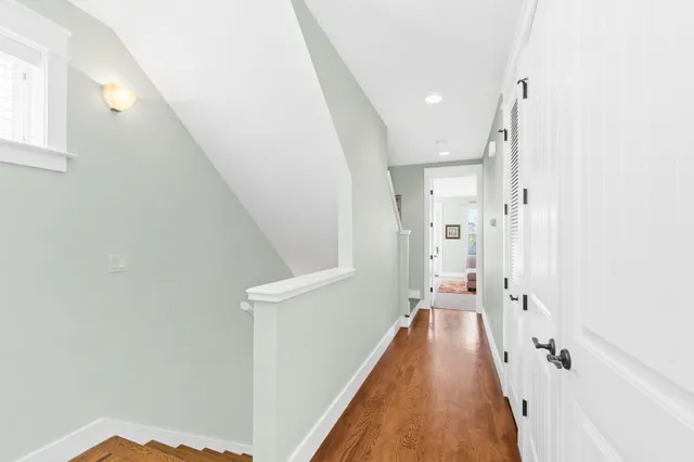 a view of a hall with stairs