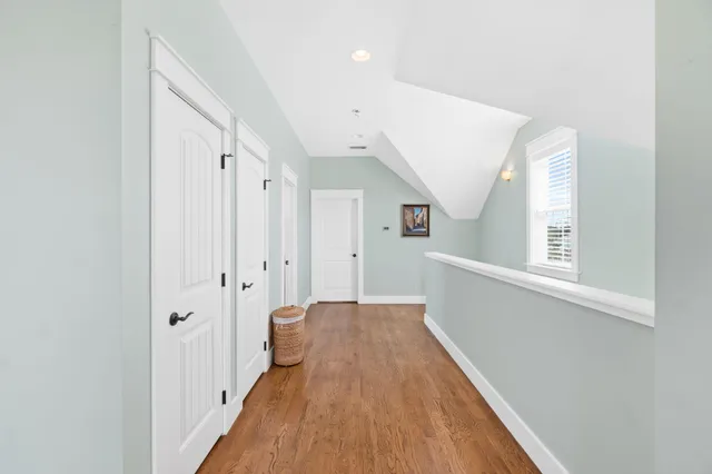 a bathroom with a granite countertop sink a toilet and a mirror