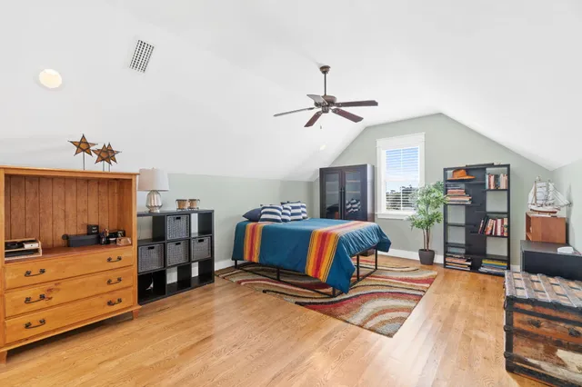 a bedroom with a bed and dresser