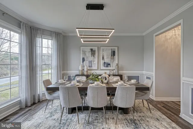 a living room with furniture a window and a fireplace