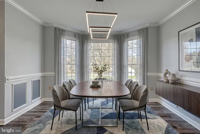 wooden floor fireplace and windows in an empty room