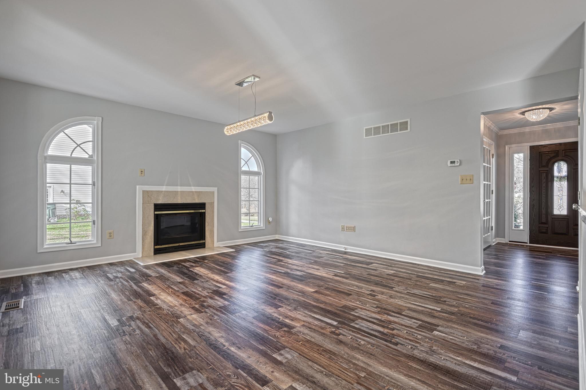14 Kratz Road Shrewsbury, PA 17361 - Photo 30 of 137 wooden floor fireplace and windows in an empty room