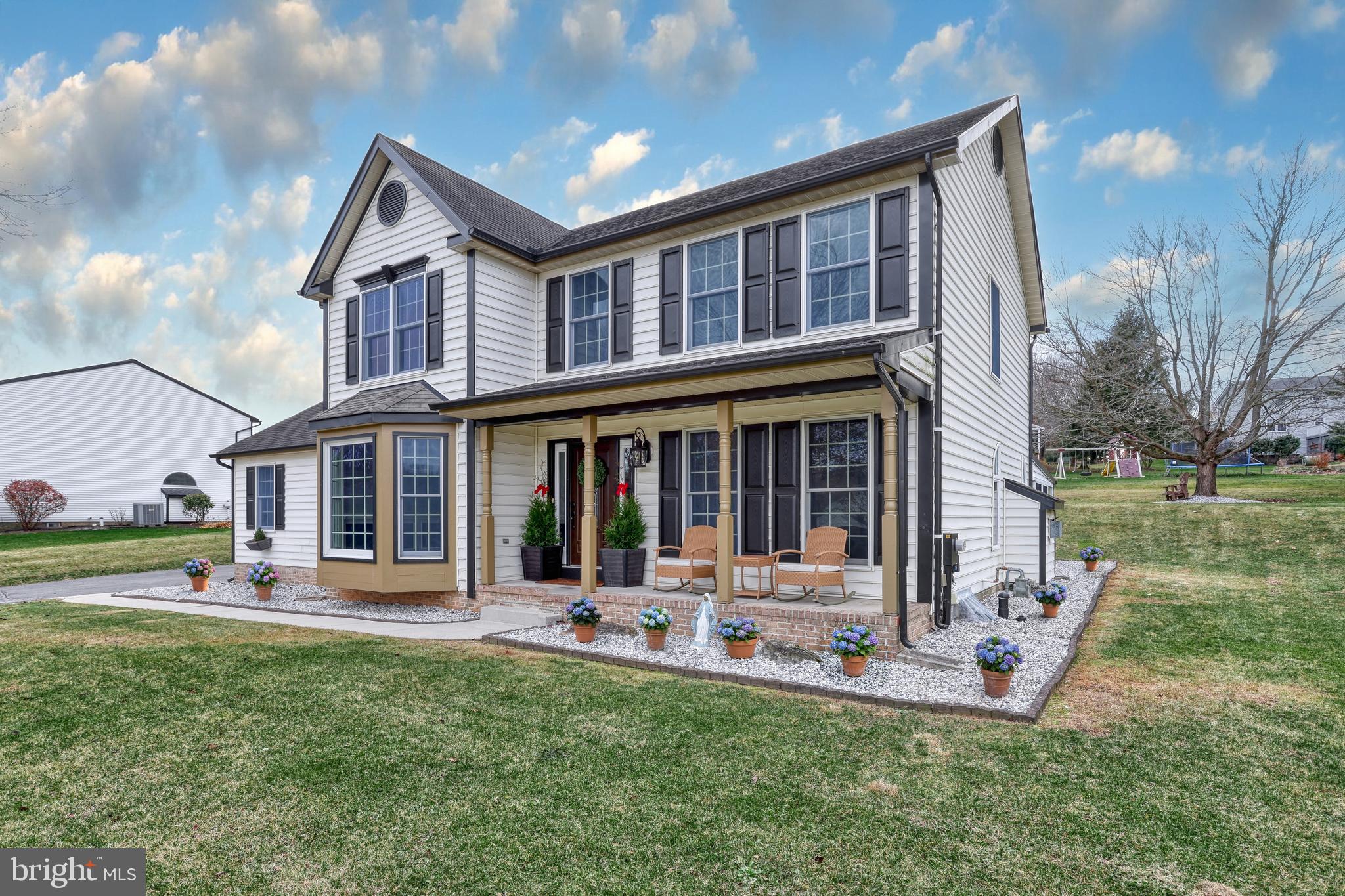 14 Kratz Road Shrewsbury, PA 17361 - Photo 3 of 137 a front view of a house with a yard table and chairs