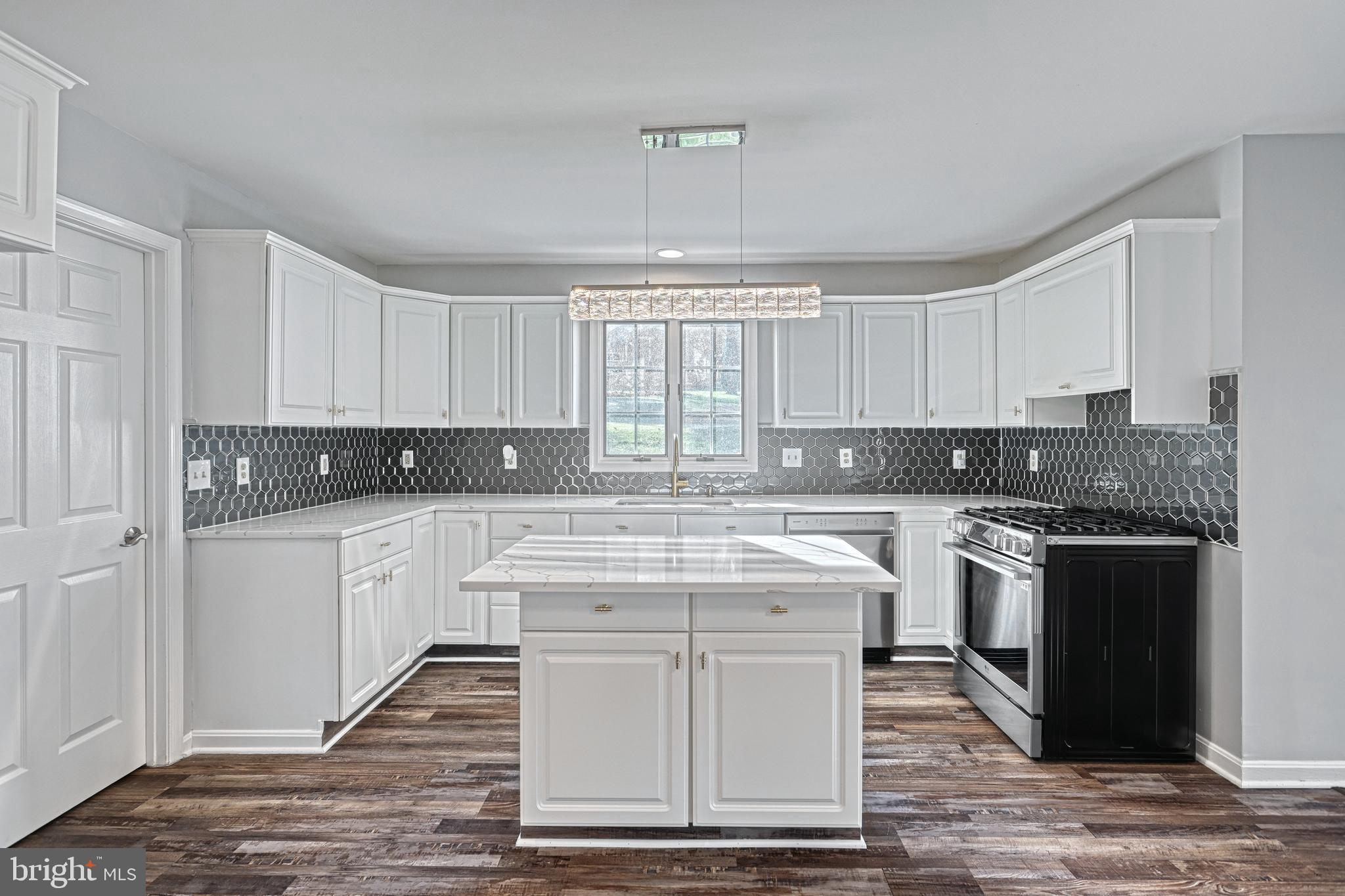 14 Kratz Road Shrewsbury, PA 17361 - Photo 37 of 137 a kitchen with stainless steel appliances granite countertop a stove sink and cabinets
