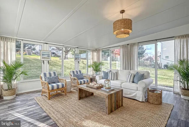 a aerial view of a house next to a yard