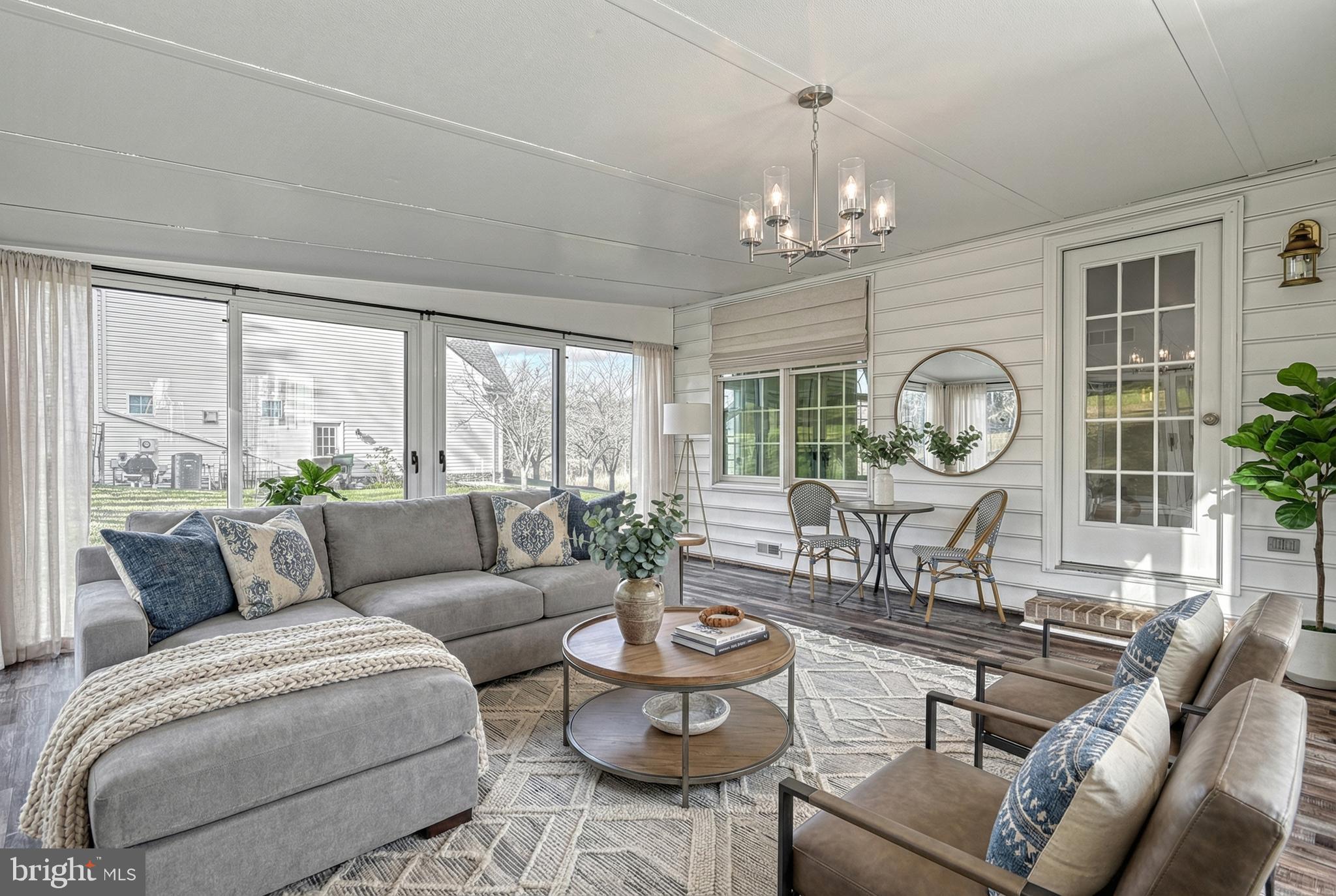 14 Kratz Road Shrewsbury, PA 17361 - Photo 53 of 137 a living room with furniture a chandelier and a large window