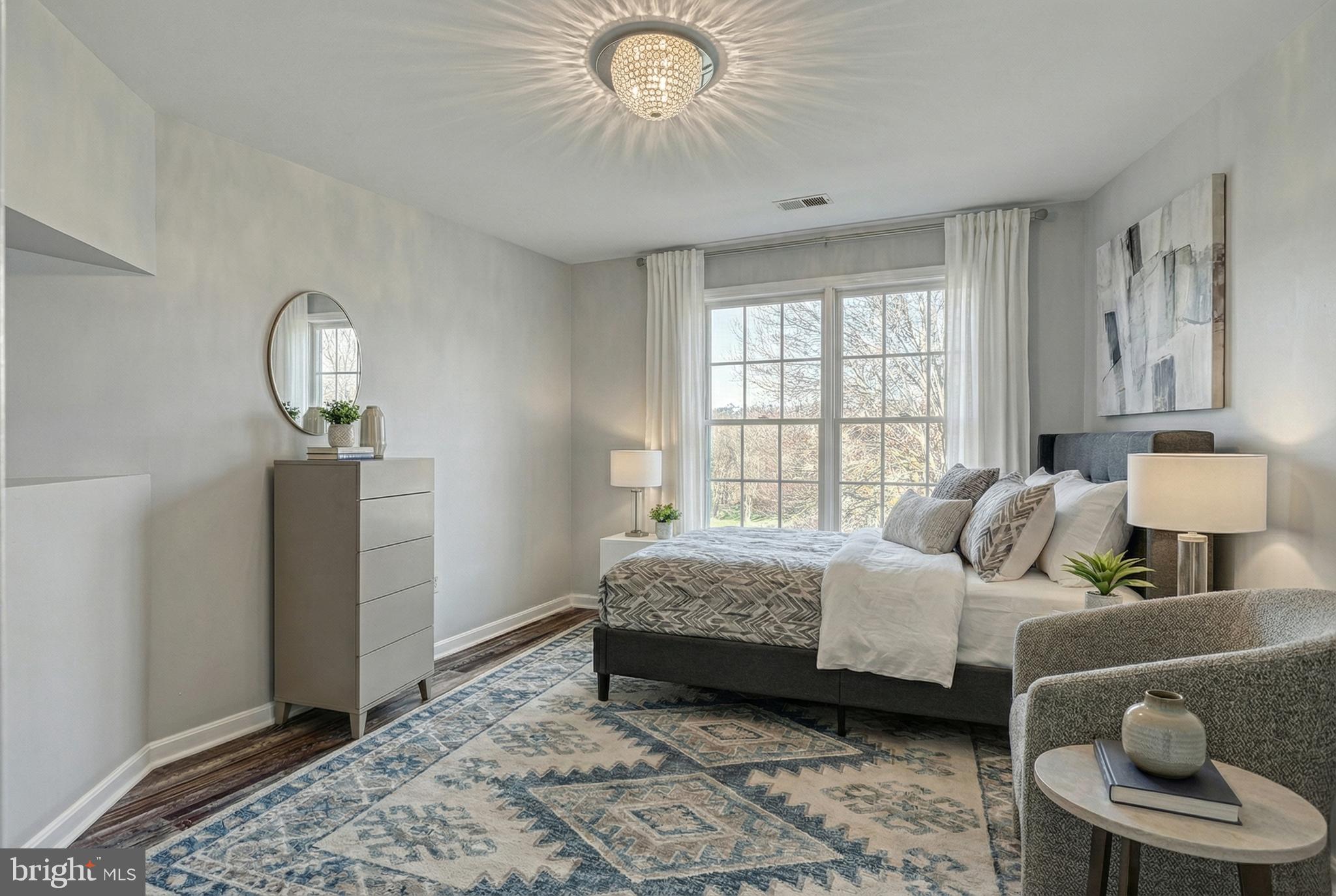 14 Kratz Road Shrewsbury, PA 17361 - Photo 66 of 137 a bedroom with a bed and a chandelier