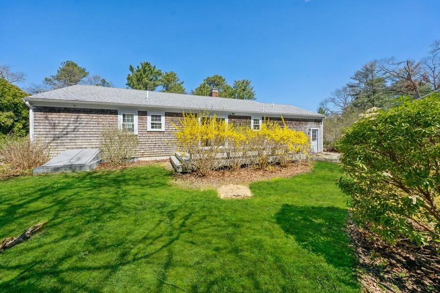 51 Carrie Lee's Way Centerville, MA 02632 - Photo 15 of 15 a front view of a house with garden