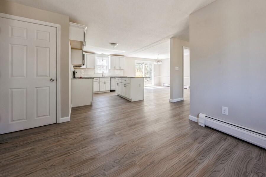 51 Carrie Lee's Way Centerville, MA 02632 - Photo 3 of 15 a view of a kitchen with wooden floor and electronic appliances