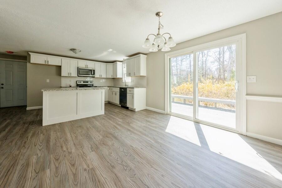 51 Carrie Lee's Way Centerville, MA 02632 - Photo 6 of 15 a view of a kitchen with microwave and stove