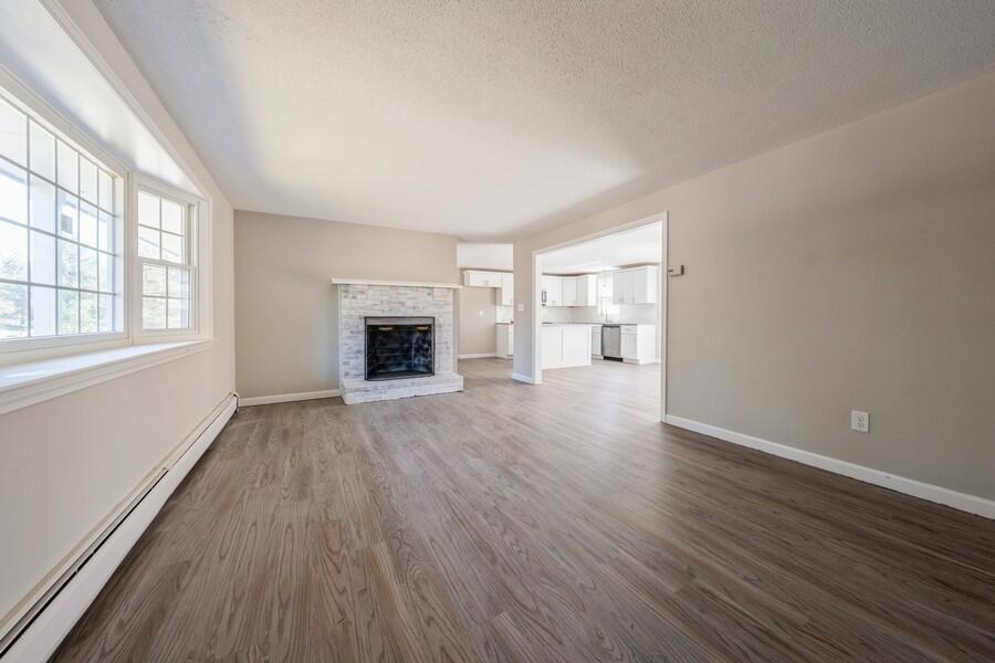 51 Carrie Lee's Way Centerville, MA 02632 - Photo 8 of 15 an empty room with wooden floor and a window