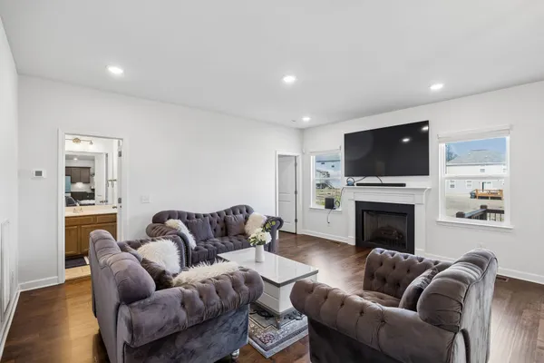 a bathroom with a sink a toilet and shower curtain