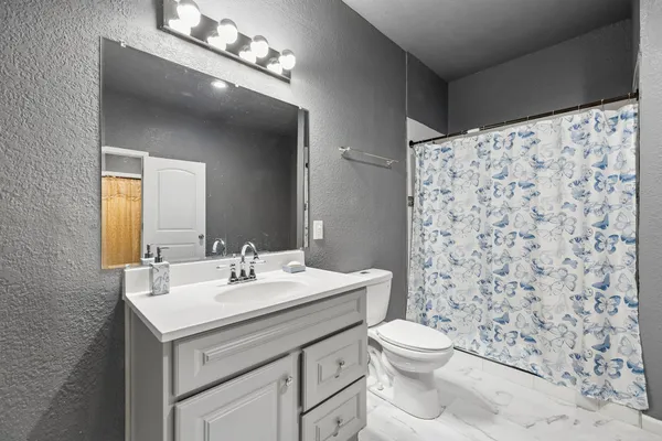 a bedroom with a bed and a cabinets