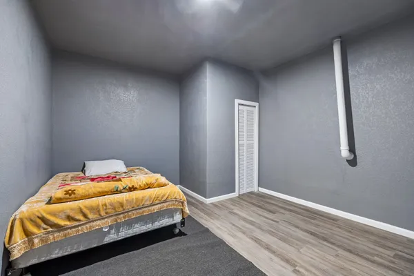 a view of a hallway with a couch and a dresser
