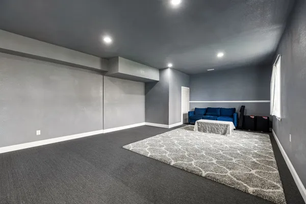 a bedroom with a bed closet and flat tv screen