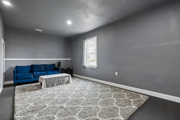 a bathroom with a sink a toilet and shower curtain