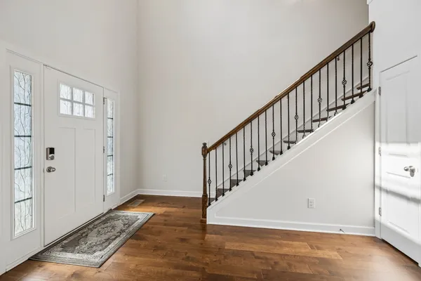 a living room with furniture potted plant and a window