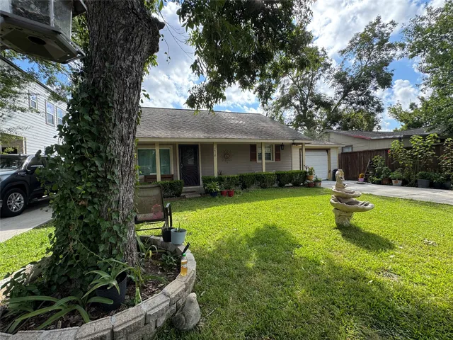 a front view of a house with swimming pool having outdoor seating