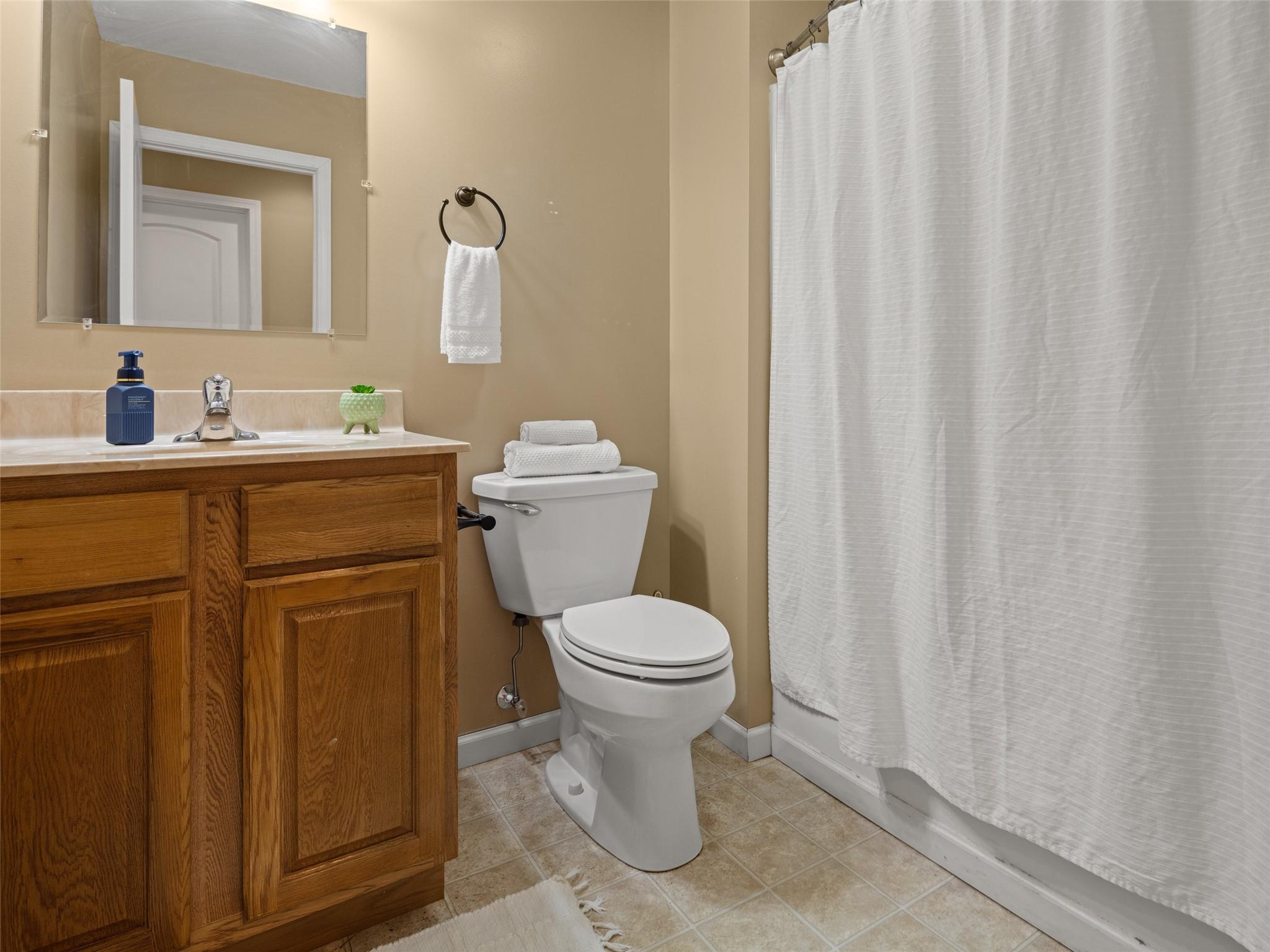 150 Barefoot Ridge Clyde, NC 28721 - Photo 11 of 27 a bathroom with a toilet sink and mirror