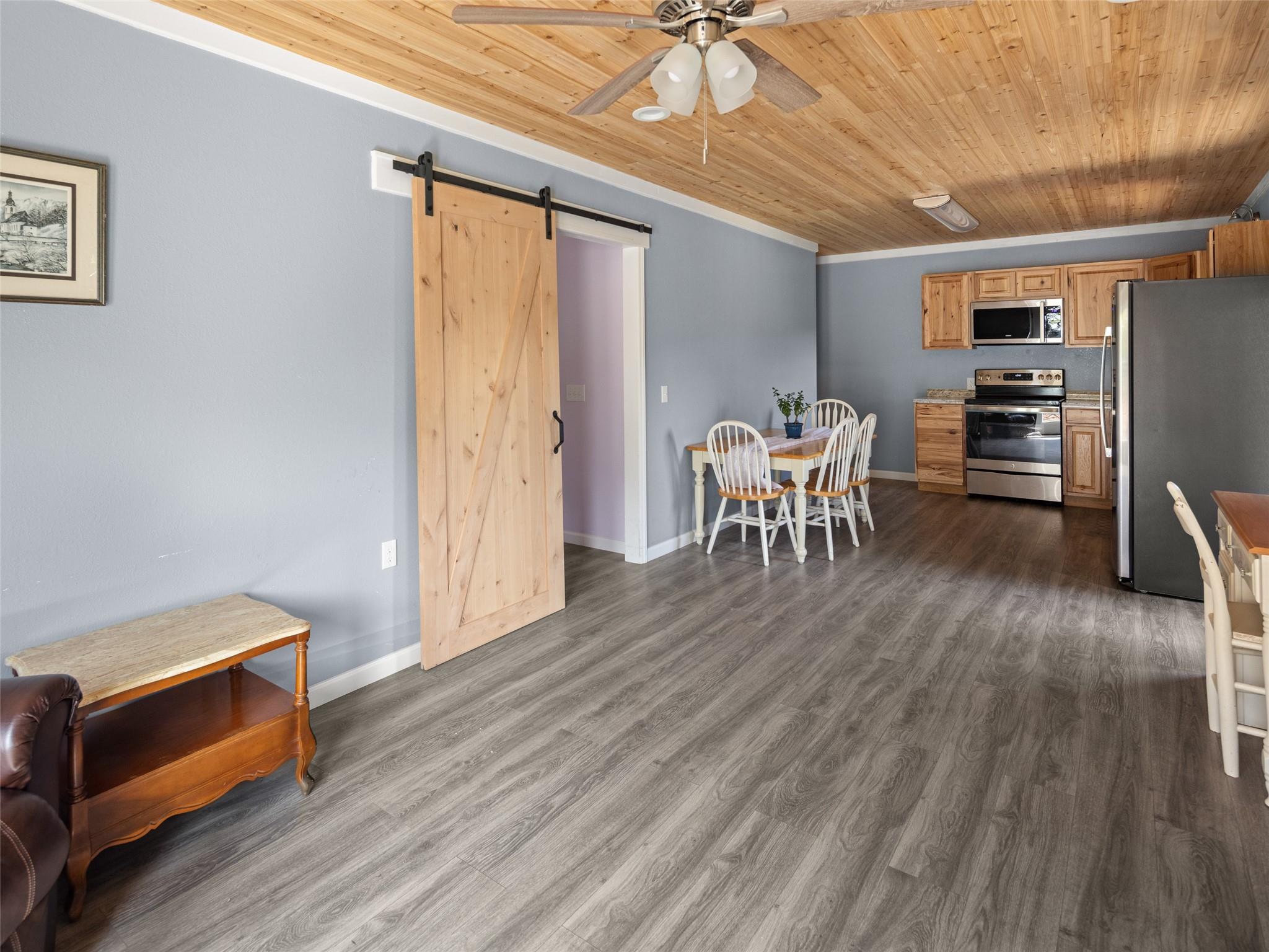 150 Barefoot Ridge Clyde, NC 28721 - Photo 13 of 27 a dining room with furniture and wooden floor