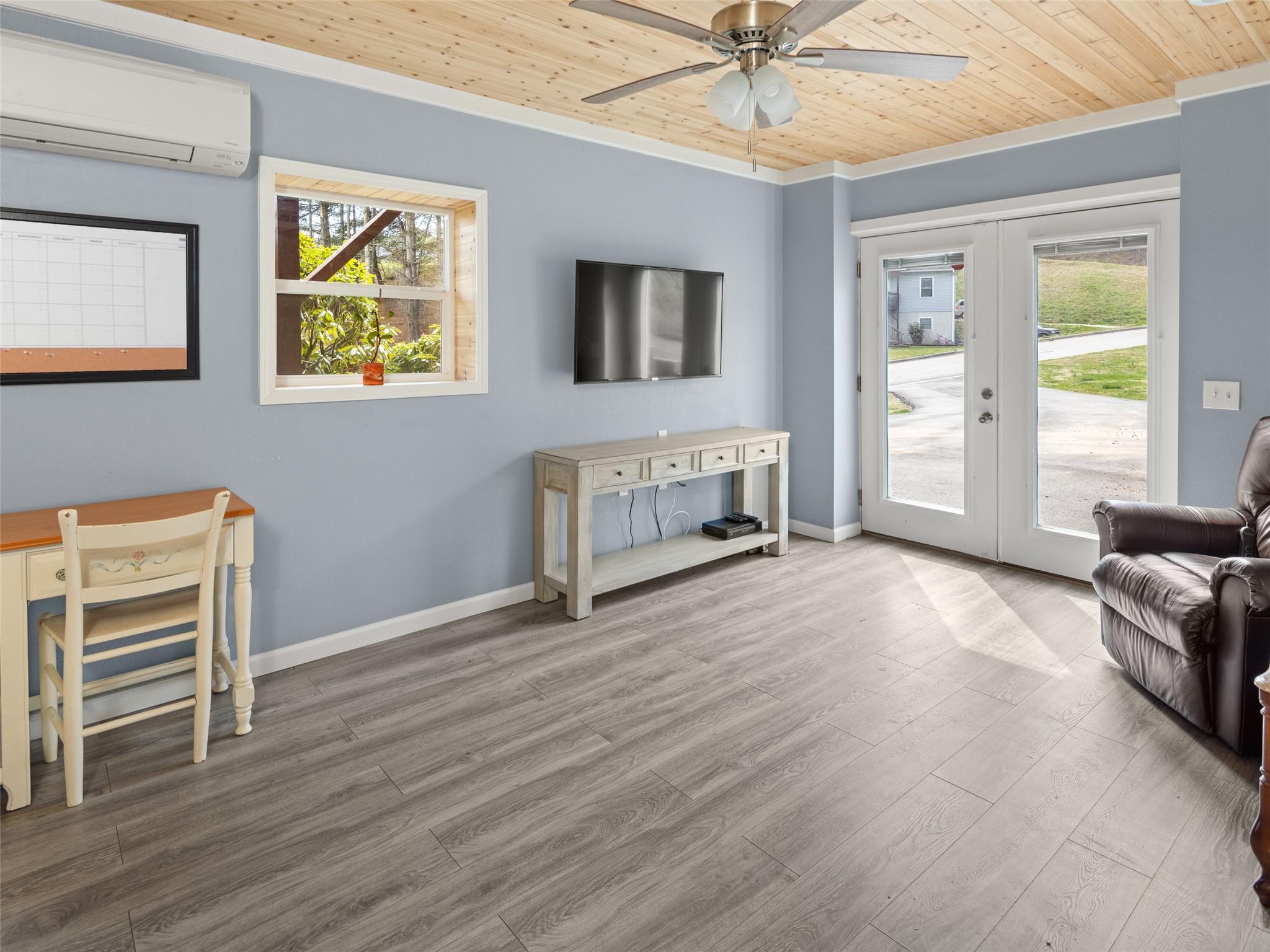 150 Barefoot Ridge Clyde, NC 28721 - Photo 17 of 27 a view of livingroom with hardwood floor and ceiling fan