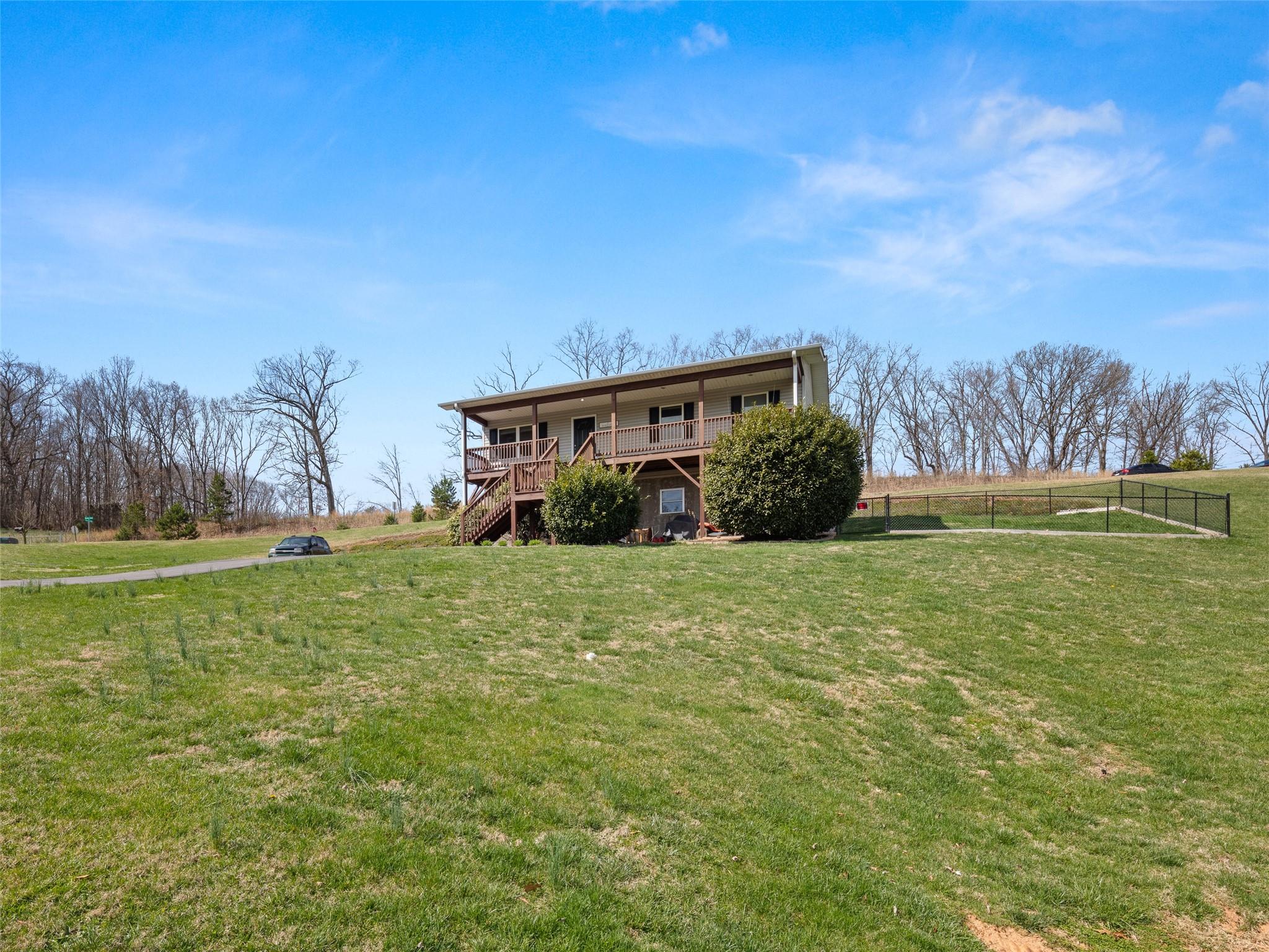 150 Barefoot Ridge Clyde, NC 28721 - Photo 22 of 27 a view of a house with a yard
