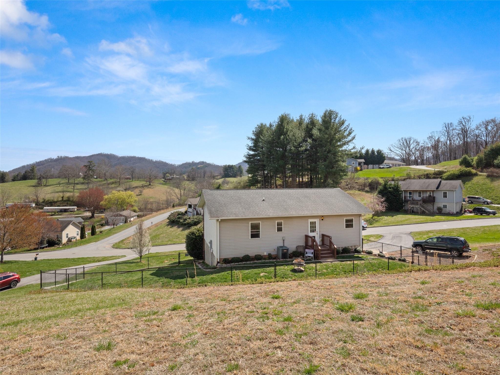 150 Barefoot Ridge Clyde, NC 28721 - Photo 24 of 27 a view of a house with a big yard