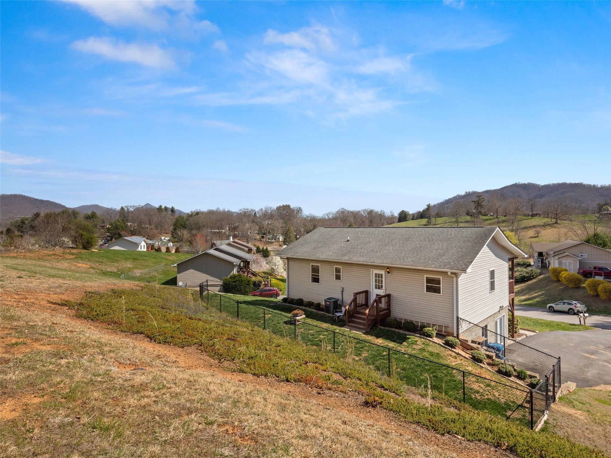 150 Barefoot Ridge Clyde, NC 28721 - Photo 25 of 27 an aerial view of residential houses and trees