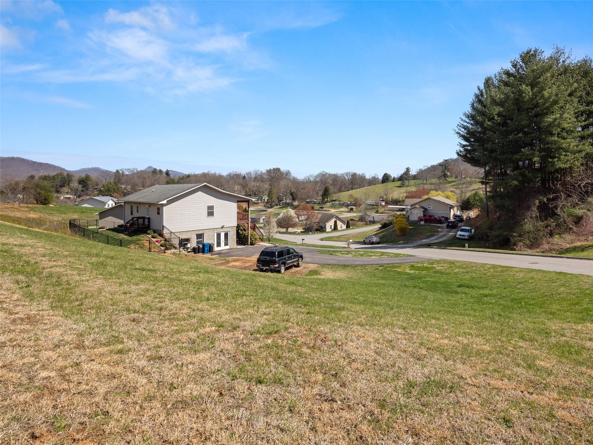 150 Barefoot Ridge Clyde, NC 28721 - Photo 26 of 27 a view of a town with big trees