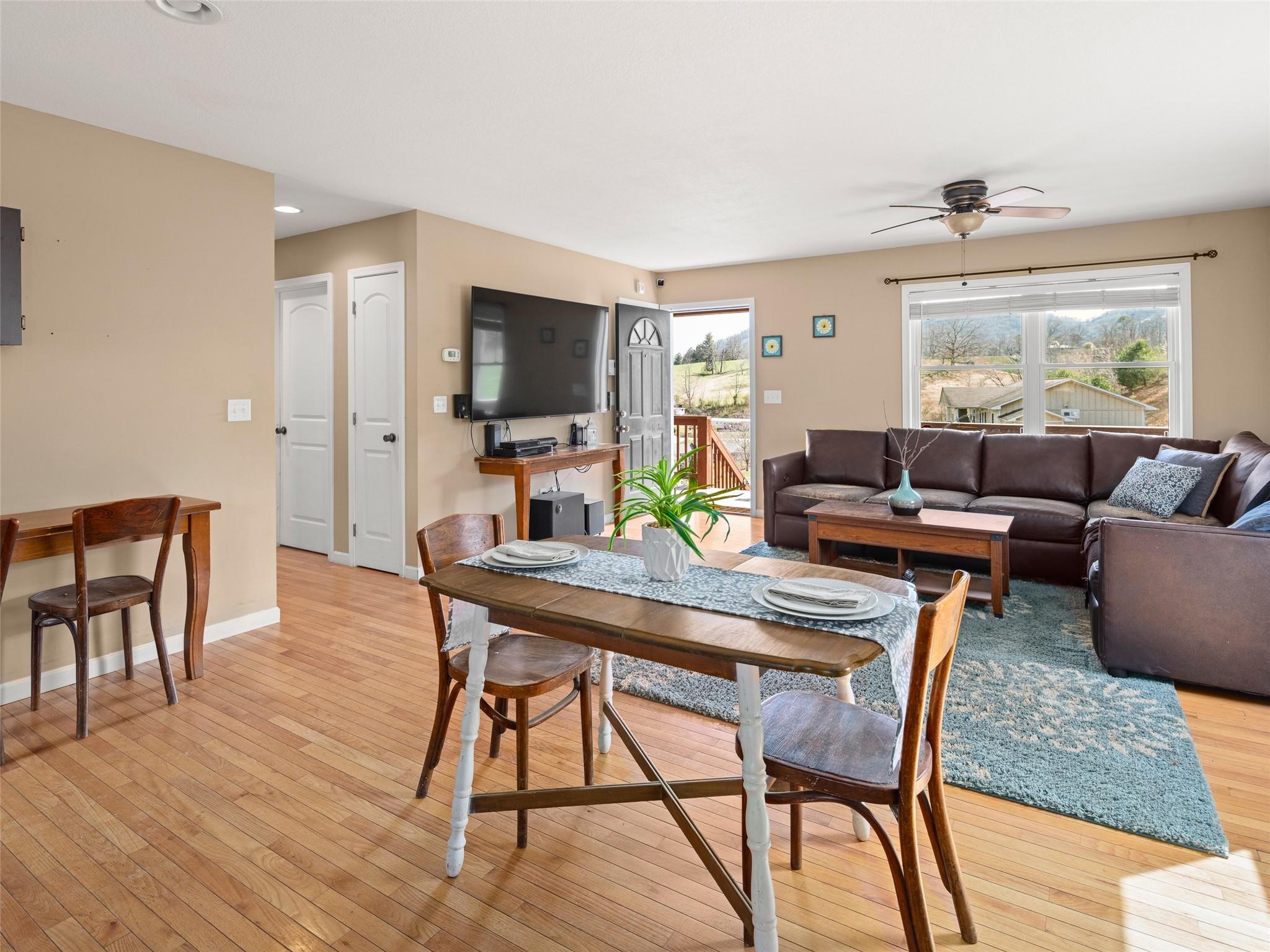 150 Barefoot Ridge Clyde, NC 28721 - Photo 5 of 27 a living room with furniture and a flat screen tv