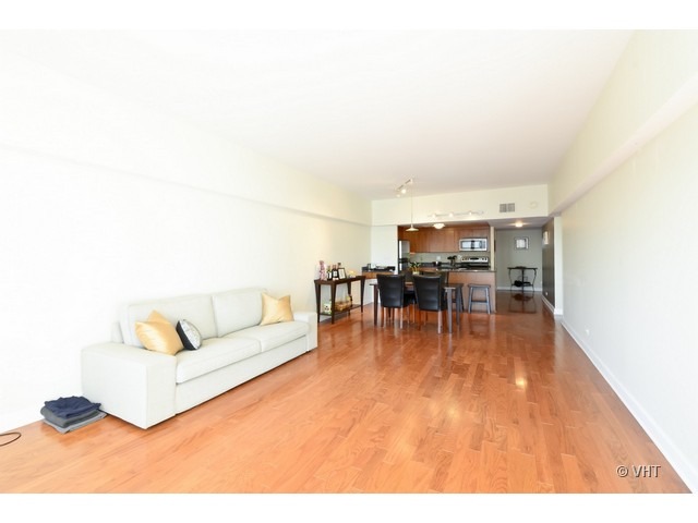 175 East Delaware Place, Unit 4522 Chicago, IL 60611 - Photo 4 of 15 a living room with furniture and a wooden floor