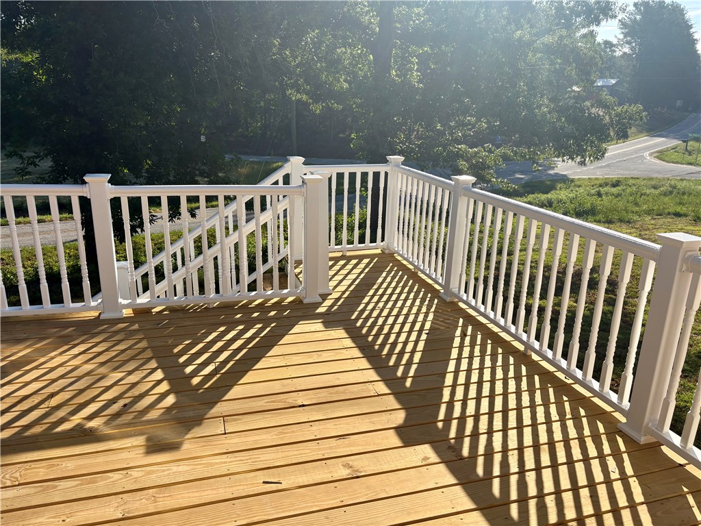 351 Randys Road Westminster, SC 29693 - Photo 16 of 30 A well-maintained wood deck with pristine white railings offers an inviting outdoor space.