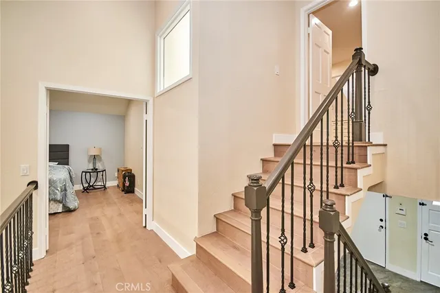 a view of an entryway with wooden floor and windows