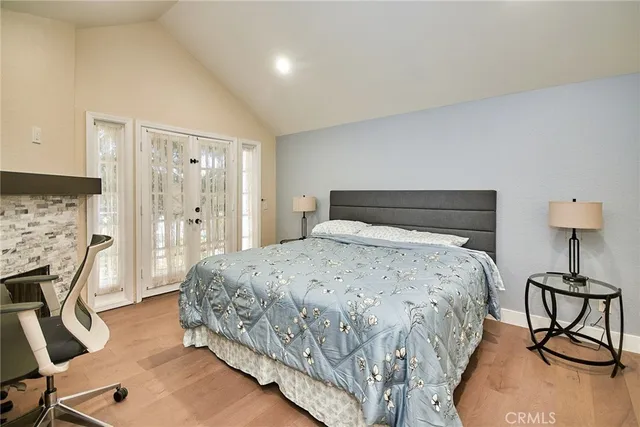 a bedroom with a bed and a table in it