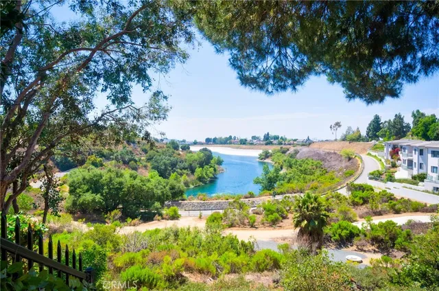 a view of a patio with table and chairs and potted plants