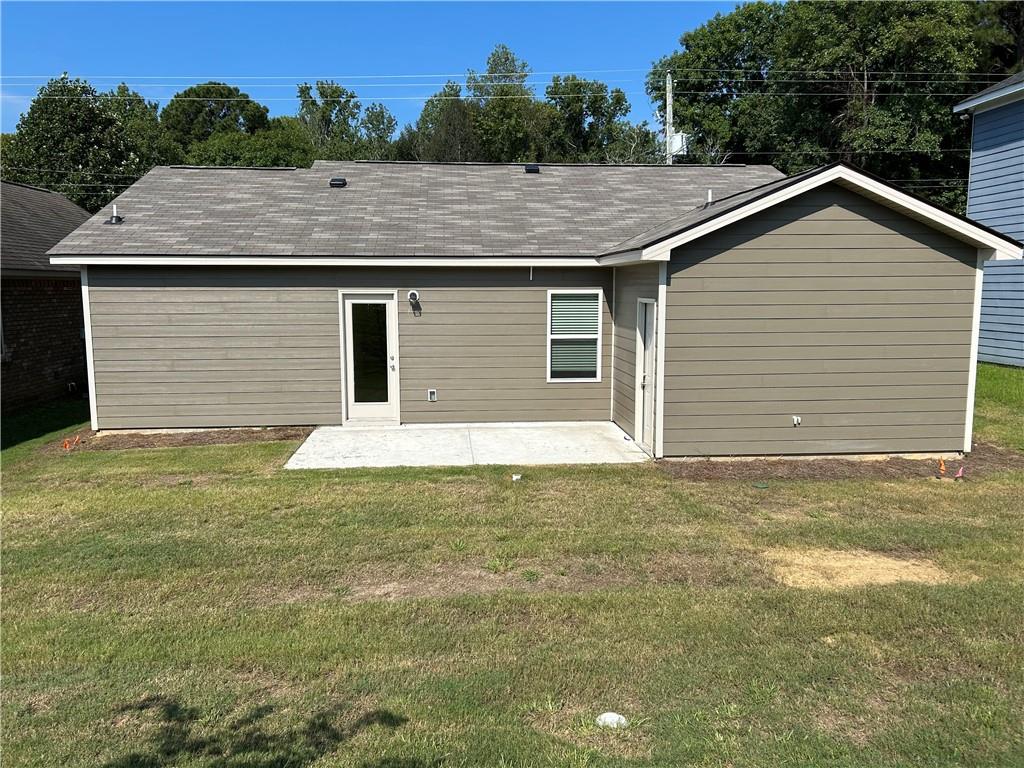 31 Whiterock Road Phenix City, AL 36869 - Photo 15 of 36 Back of property with a patio, a yard, and a shingled roof