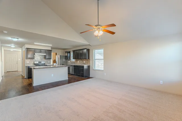 a view of a kitchen with a sink cabinets and window