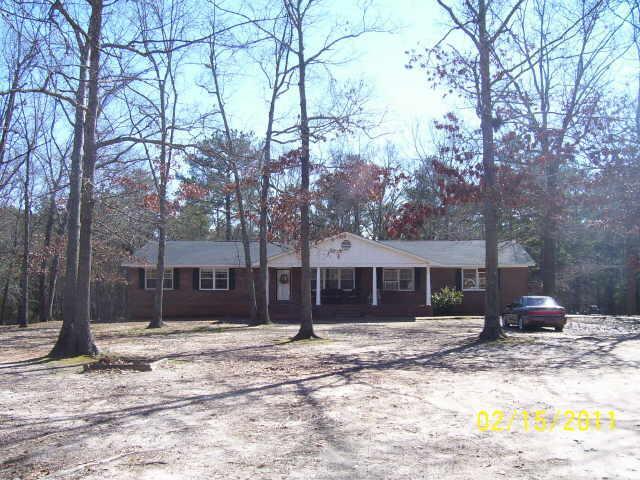 208 Whatley Road Griffin, GA 30224 - Photo 1 of 1 a front view of a house with a yard covered in snow