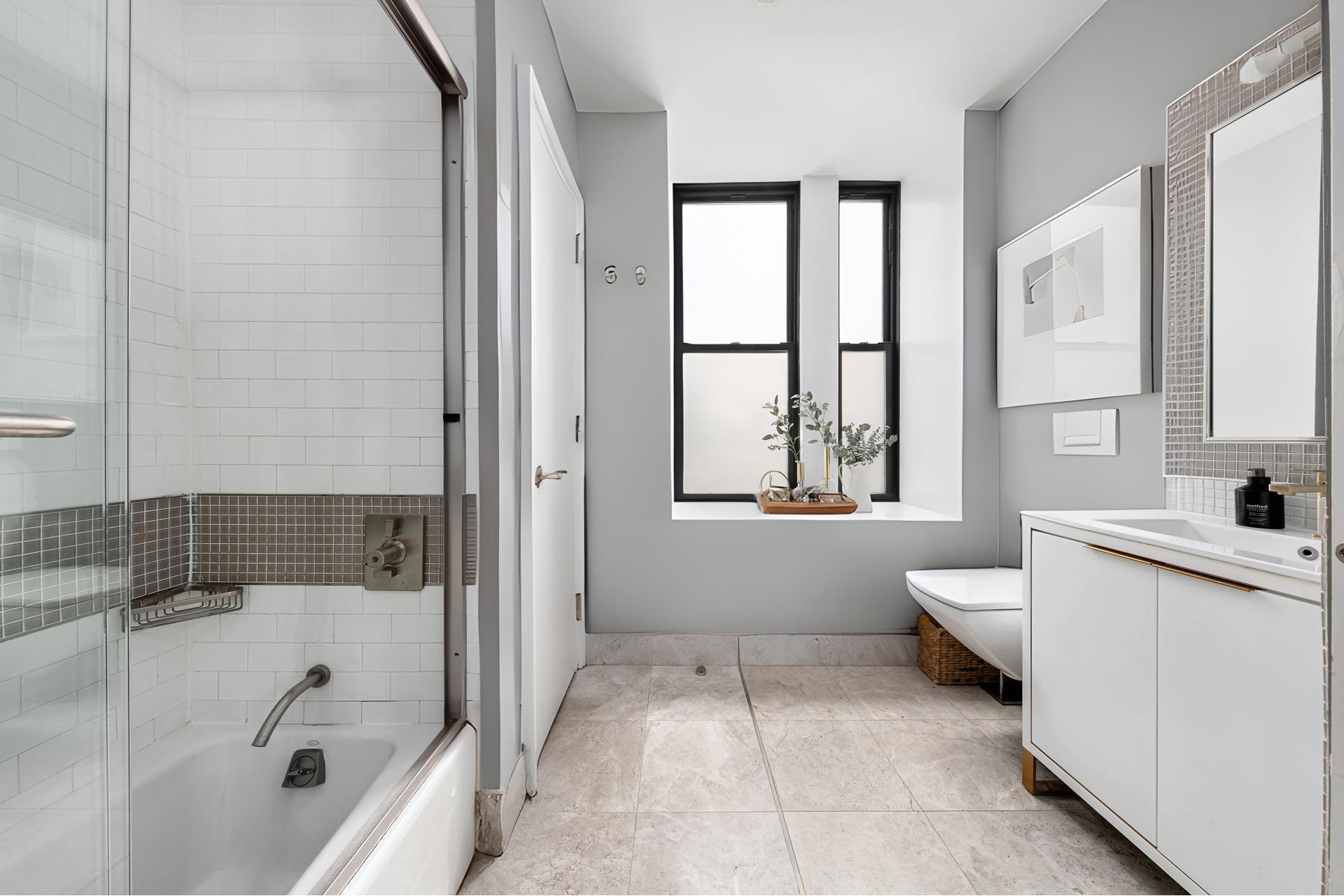 219 West 81st Street, Unit 4A Manhattan, NY 10024 - Photo 11 of 21 a bathroom with a tub sink and mirror