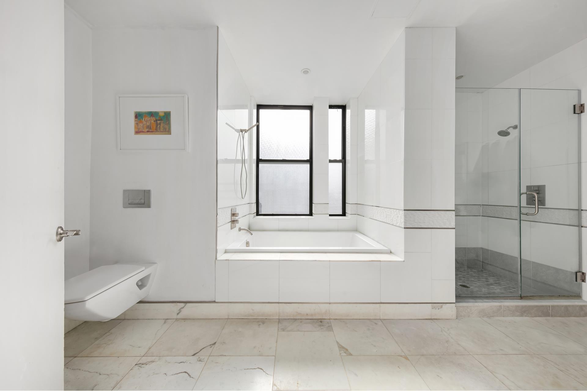 219 West 81st Street, Unit 4A Manhattan, NY 10024 - Photo 8 of 21 a bathroom with a tub shower and toilet