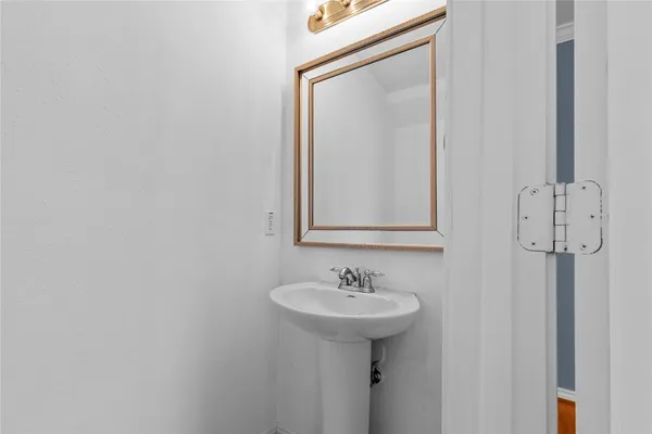 a bathroom with a sink and mirror