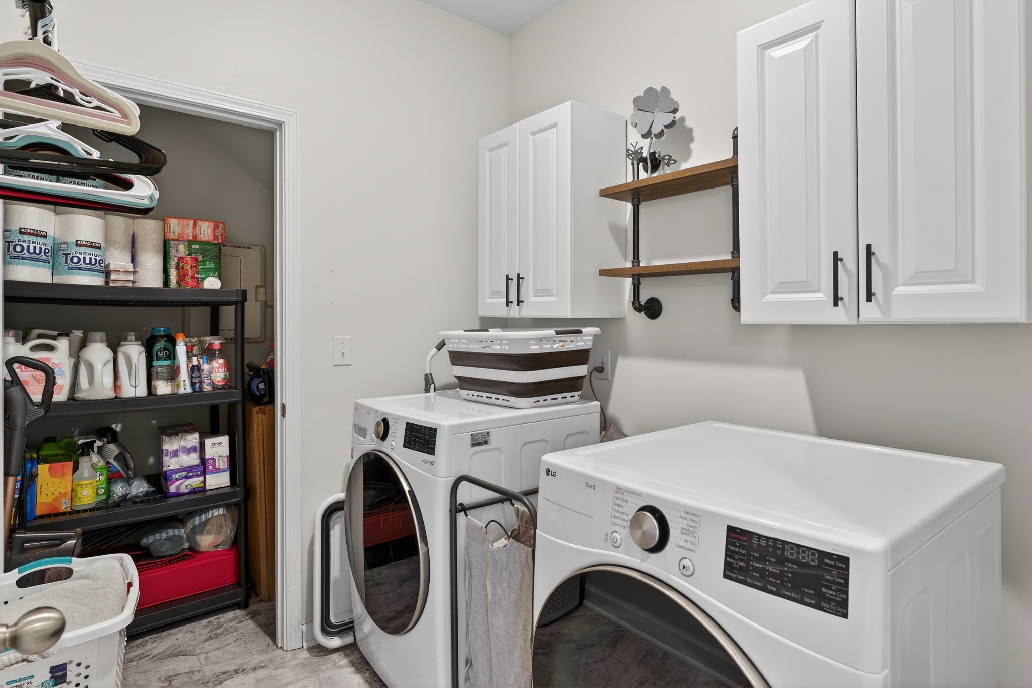 306 William Dylan Drive Murfreesboro, TN 37129 - Photo 17 of 47 a utility room with dryer washer and a view of bookshelf