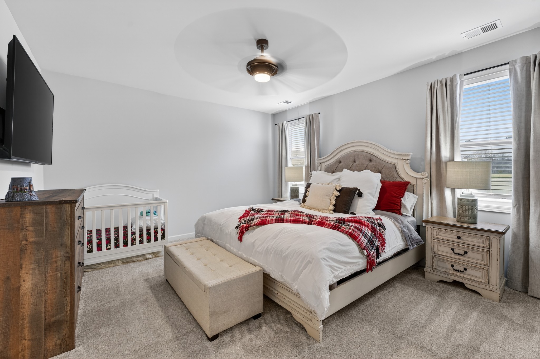 306 William Dylan Drive Murfreesboro, TN 37129 - Photo 18 of 47 a bedroom with a bed and a flat tv screen on the dresser